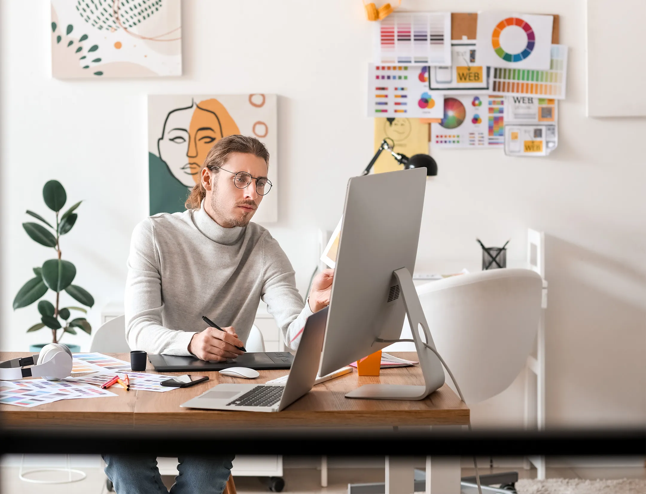 Design studio workspace with mood boards and sketches